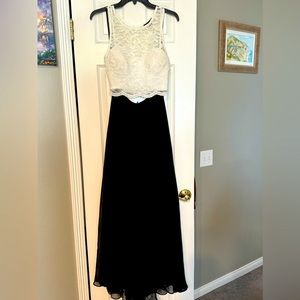 Two piece white  sparkle lace top with black flowing skirt. Size:5. Formal wear.